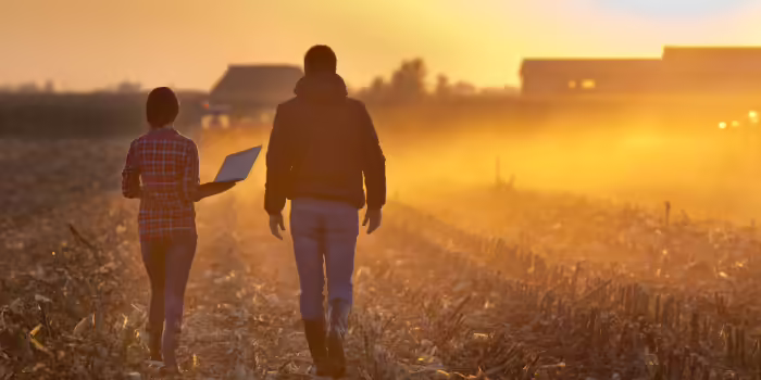 Two farmers in a field.