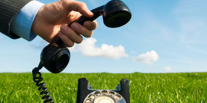 man picking up a phone