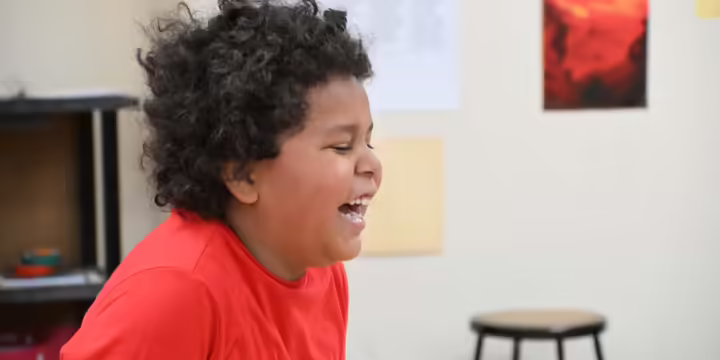 a boy laughing