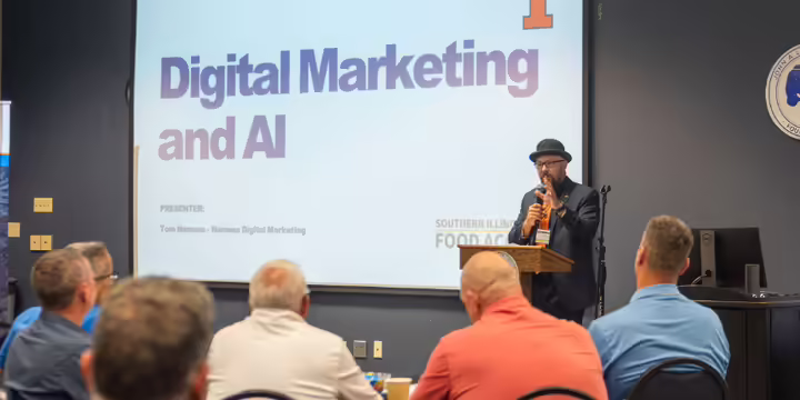 Speaker making presentation at 2025 grocer summit