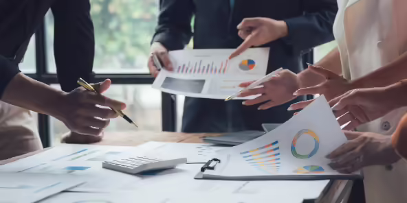 people reviewing graphs