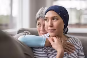 Cancer patient hugging family member