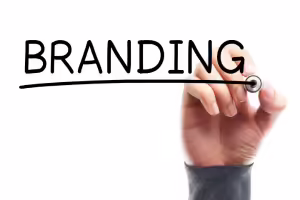 person writing word branding