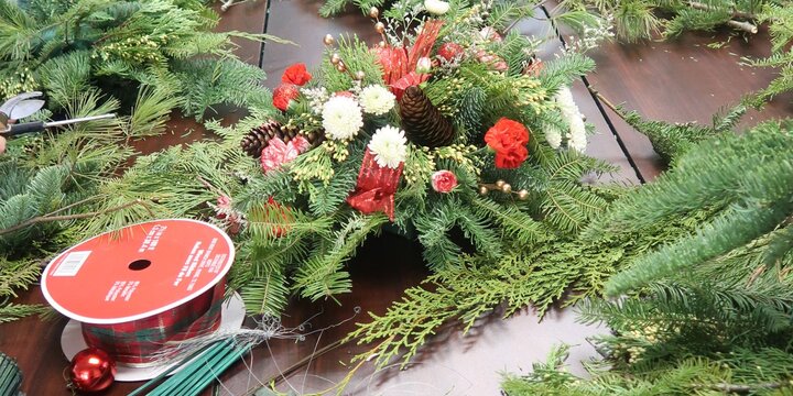 evergreen centerpiece on a work table