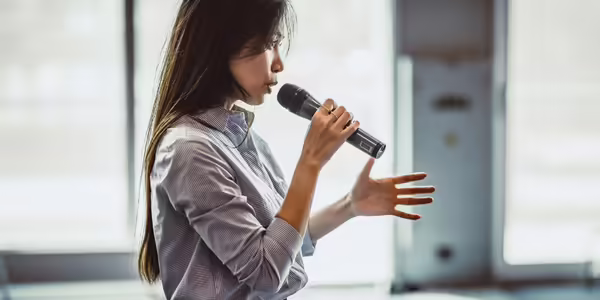 Lady speaking into microphone 