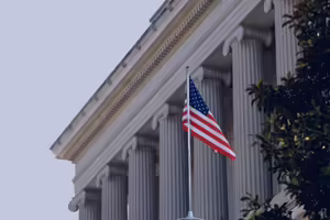 american flag in front of government building