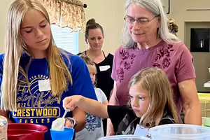 three generations making bread