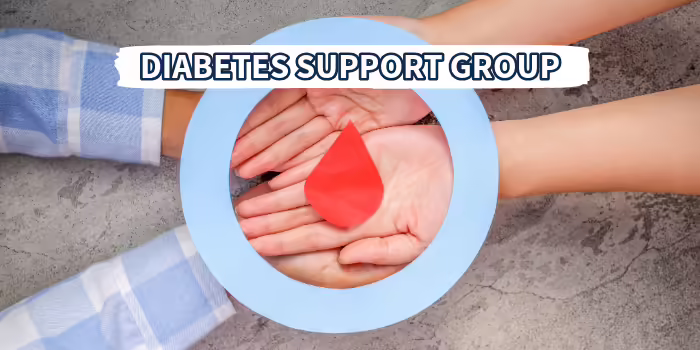 A close upHands gathered in a circle holding a red blood drop symbol with the words ‘Diabetes Support Group. view of hands joined together with the 
