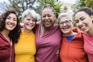 Group of five women smiling