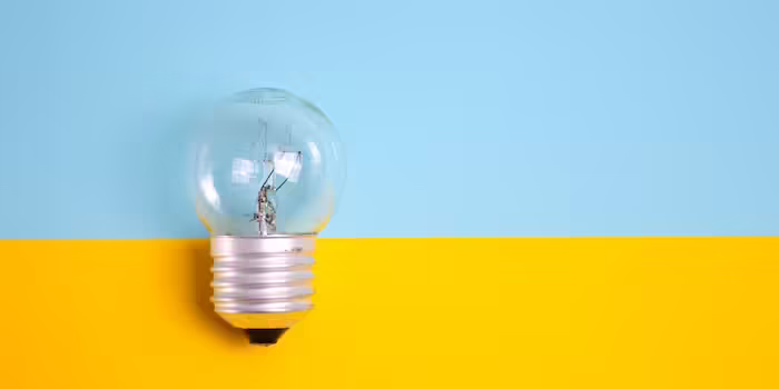 Photo of lightbulb on colorful background.