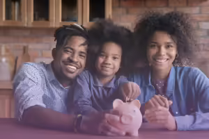 parents talking with child with piggy bank