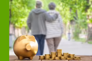 older couple walking. piggy bank with money outside of it.