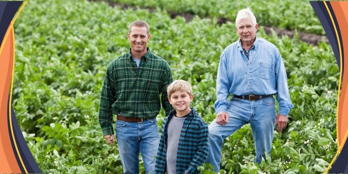 three generations of farmers standing in field