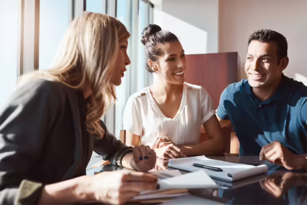 a couple with a financial planner 