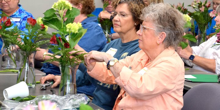 Attendees make a floral arrangement at Gardener's Big Day event