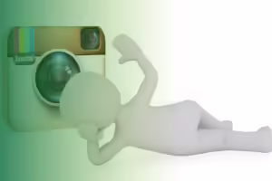 stick person laying in front of a insta camera