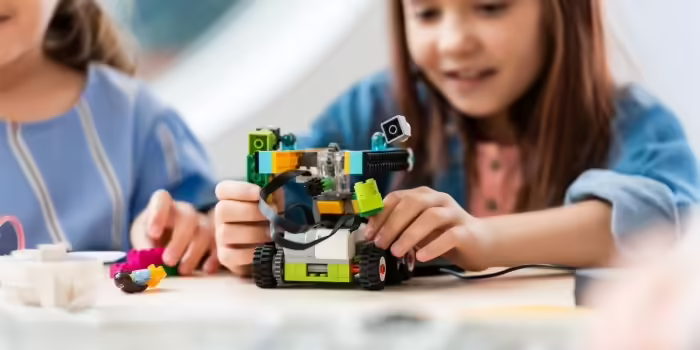 Girl with a robot she made 