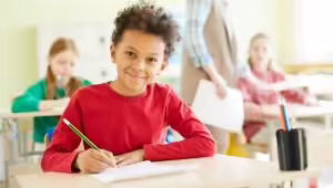 Student at desk in classroom