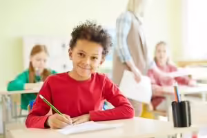 Student at desk in classroom