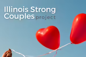 a hand holding 2 red heart balloons floating in the air