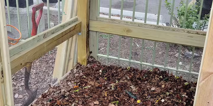 food scraps and yard waste in a compost bin