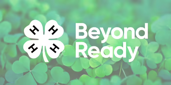 A field of clover with the words Beyond Ready and the 4-H logo 