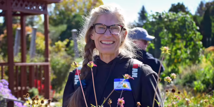 lady smiling in a flower garden