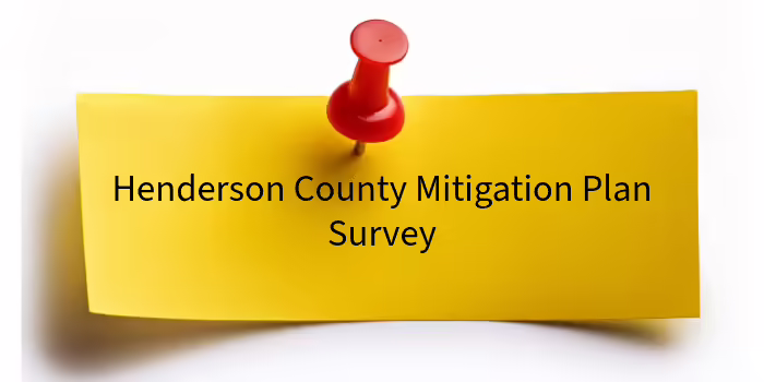 A yellow post-it note with the words Henderson County Mitigation Survey.