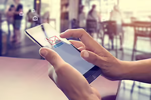 Hands holding smart phone checking email