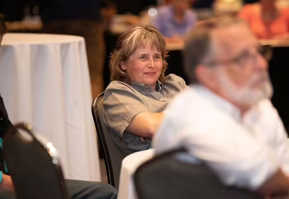 people at a table in meeting