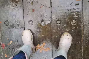 Child splashing in puddle