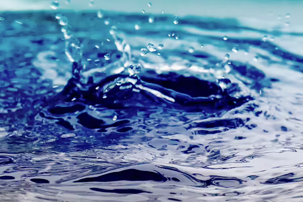 water falling on puddle