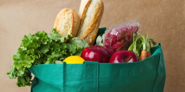 Bag of fresh vegetables and bread