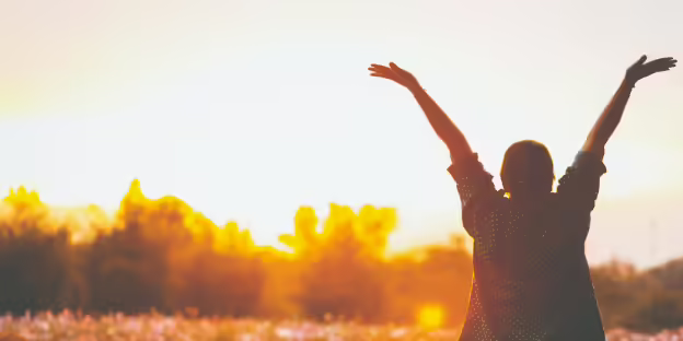 Person throwing their hands in the air 