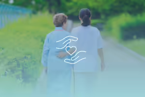 Young woman walking with elderly woman in garden