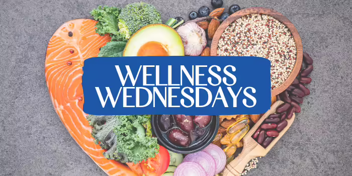 A display of fruits, vegetables, and healthy food in the shape of a heart with overlay text.