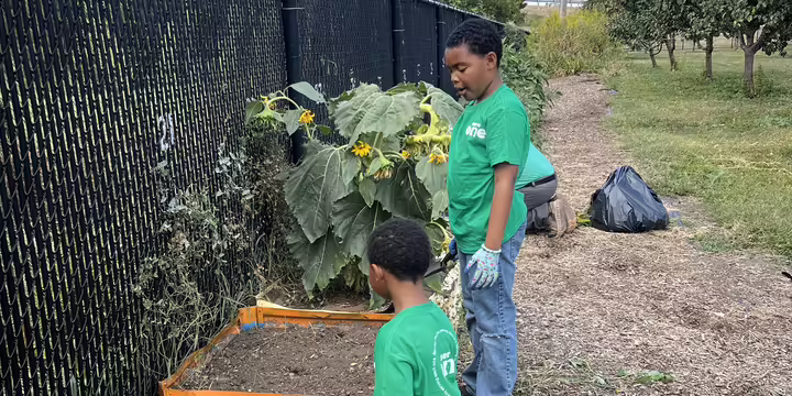 Two youth at Crossing Healthcare Garden
