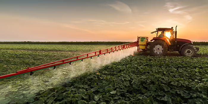 tractor spraying pesticide