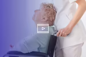 person pushing woman in wheelchair