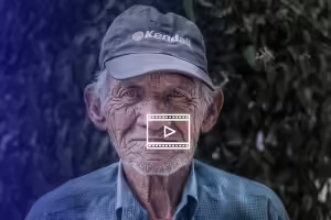older man in ball cap