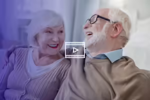 older man and woman smiling