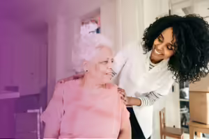 an aging black woman being taken care of in her home by a younger black female
