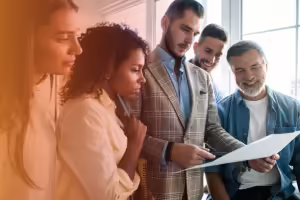 men and women talking about a plan