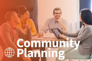 men and women sitting around a table talking