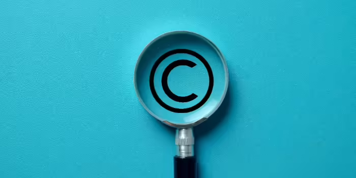 copyright mark behind magnifying glass