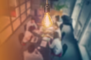 men and women around a table talking