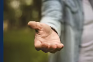 a person outstretching their hand
