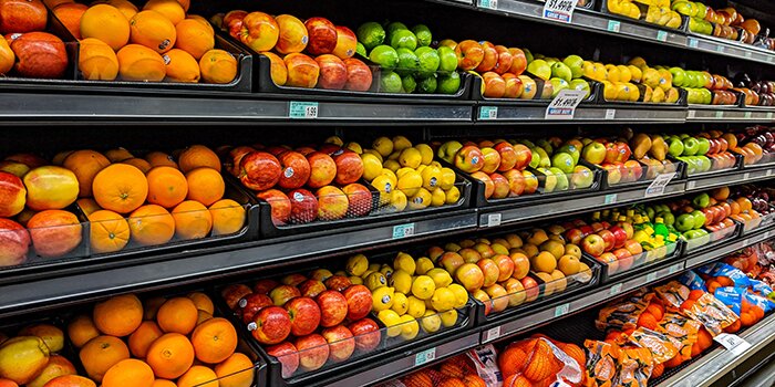 fresh fruit on shelves in a store
