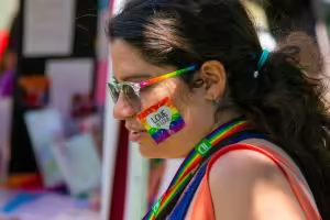 Person with rainbow colored accessories 