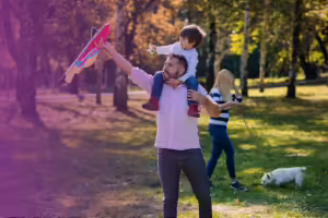 dad with his son flying a kite